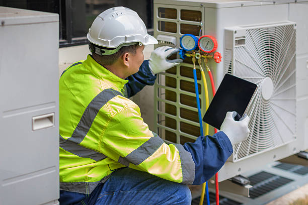 Professional Air Duct Cleaning technician working in Mountainburg, AR